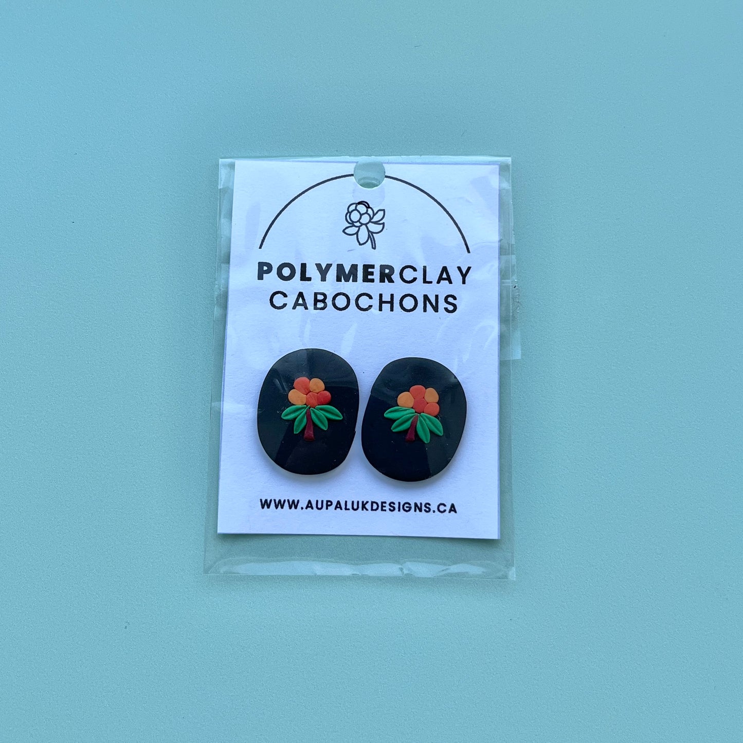 Aqpik on Black Polymer Clay Handmade Cabochon, Small